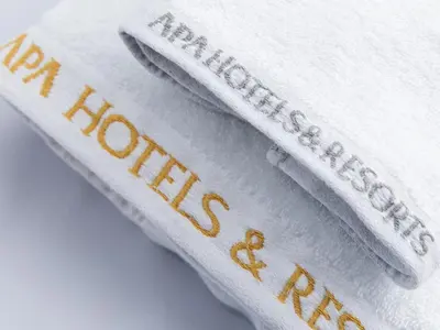 three white towels with the words harry potter on them at APA Hotel & Resort Roppongi Ekihigashi in Tokyo