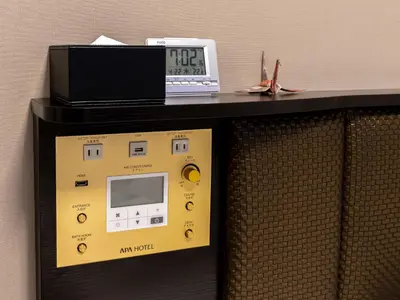 a machine with a clock on top of it at APA Hotel & Resort Roppongi Ekihigashi in Tokyo