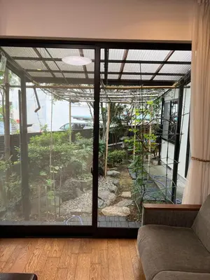 a living room with a large sliding glass door at japan house shinkoiwa guest house in Tokyo