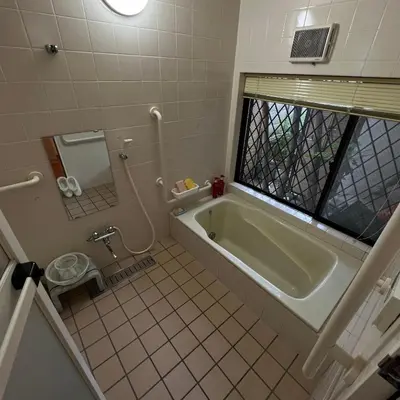 a bathroom with a bath tub and a toilet at japan house shinkoiwa guest house in Tokyo