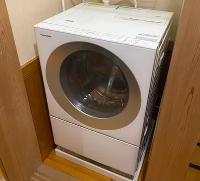 a white washing machine in a corner of a room at Japanese traditional house.Ryokan in asakusa with 2bedrooms in Tokyo