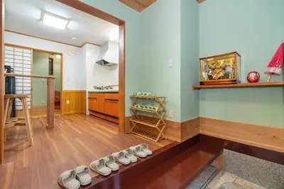 a room with a bunch of shoes on the floor at Japanese traditional house.Ryokan in asakusa with 2bedrooms in Tokyo