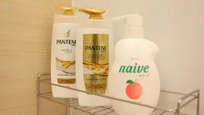 three bottles of hair products on a shelf at HOTEL ESTASIA Ryogoku - Vacation STAY 98929v in Tokyo