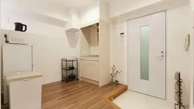 a kitchen with white walls and a sliding glass door at HOTEL ESTASIA Ryogoku - Vacation STAY 98929v in Tokyo