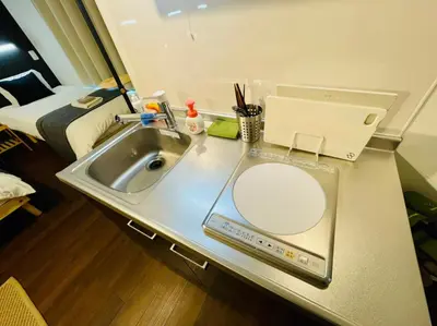 a bathroom counter with a sink and a bed at Sumida-ku - House - Vacation STAY 86935v in Tokyo