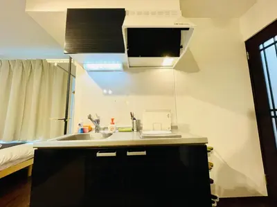 a kitchen with a sink and a microwave at Sumida-ku - House - Vacation STAY 86935v in Tokyo