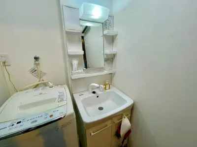 a small bathroom with a sink and a mirror at Sumida-ku - House - Vacation STAY 86935v in Tokyo