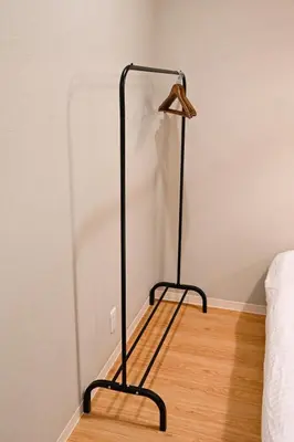 a bedroom with a bed and a black lamp at Hotel AZUMA SEE in Tokyo