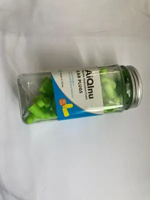 a bottle of green beans sitting on a table at AN HOTEL in Tokyo