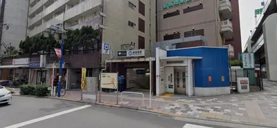 a building with a gas station on a city street at AN HOTEL in Tokyo