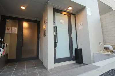 a glass door of a building with at Shinjuku area Industrial Chic apartment Walk 6min To Station in Tokyo