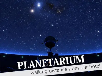 a starry night with the words planetarium walking distance from our hotel at Hotel DIAMOND in Tokyo