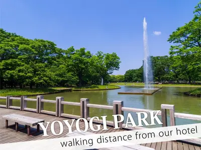 a park with a bench in front of a fountain at Hotel DIAMOND in Tokyo