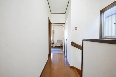 a hallway leading to a room with a window at Shinjuku area house with 3BR 2mins to Metro on foot in Tokyo