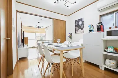 a kitchen and dining room with a table and chairs at Shinjuku area house with 3BR 2mins to Metro on foot in Tokyo