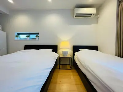 two beds sitting next to each other in a room at SALON\u6e0b\u8c375B in Tokyo