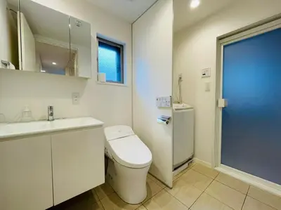 a white bathroom with a toilet and a sink at SALON\u6e0b\u8c375B in Tokyo
