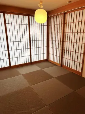 a room with large windows and a light fixture at Nplus Tokyo Akihabara Premium in Tokyo