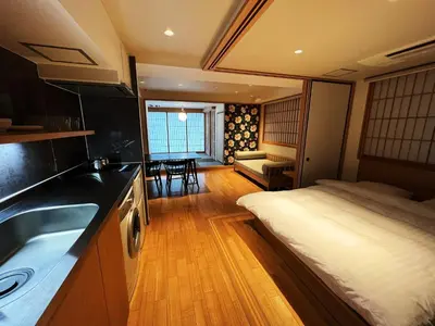 a kitchen with a bed and a sink in a room at Nplus Tokyo Akihabara Premium in Tokyo
