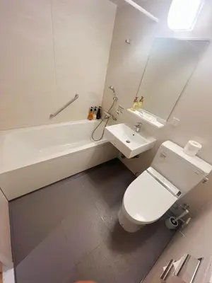 a bathroom with a toilet and a sink and a tub at Nplus Tokyo Akihabara Premium in Tokyo