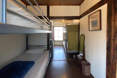 a room with two bunk beds and a hallway at Konoha house【Japanese-style guest house near Asakusa & Skytree】 in Tokyo