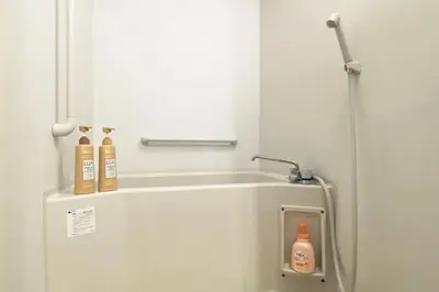 a bathroom with a sink with two bottles on it at Konoha house【Japanese-style guest house near Asakusa & Skytree】 in Tokyo
