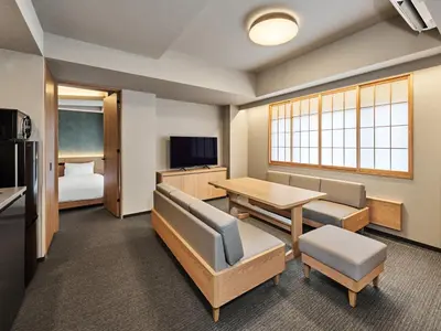 a classroom with a desk and a table and a room at MIMARU SUITES Tokyo Nihombashi in Tokyo