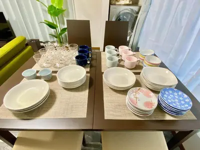 a table with plates and dishes on it at ONE HOUSE SHINKOIWA - Vacation STAY 26055v in Tokyo