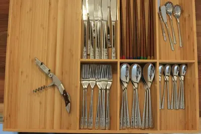 a wooden cabinet filled with lots of silver utensils at \u3077\u3075\u304b\u4e80\u6238 in Tokyo