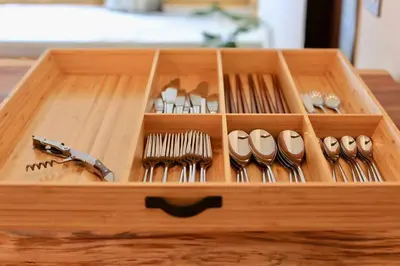 a wooden box filled with lots of hair brushes at \u3077\u3075\u304b\u4e80\u6238 in Tokyo