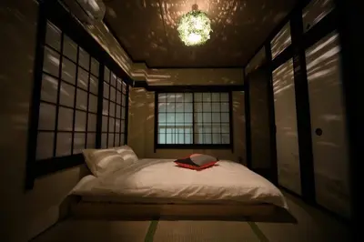 a small bed in a room with two windows at \u3077\u3075\u304b\u4e80\u6238 in Tokyo