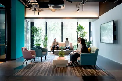 a group of people sitting in a living room at Prince Smart Inn Ebisu in Tokyo