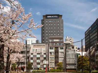 a tall building with a amazon sign on it at APA Hotel Shimbashi Toranomon in Tokyo