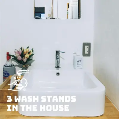 a bathroom sink with the words wash stands in the house at LovesunshineBackpackers in Tokyo