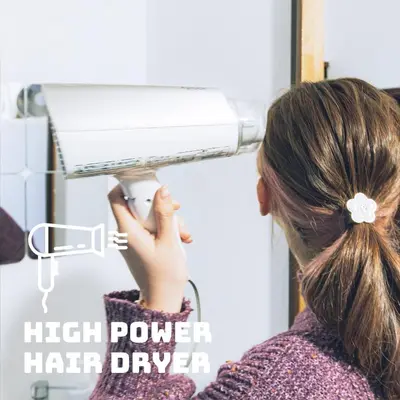 a woman is looking into a high power hair dryer at LovesunshineBackpackers in Tokyo