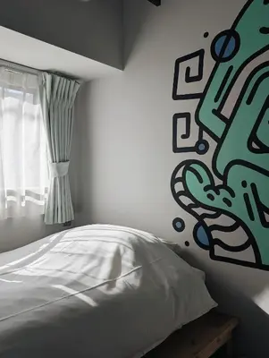 a bedroom with a white bed and a window at ART HOTELS SHIBUYA in Tokyo