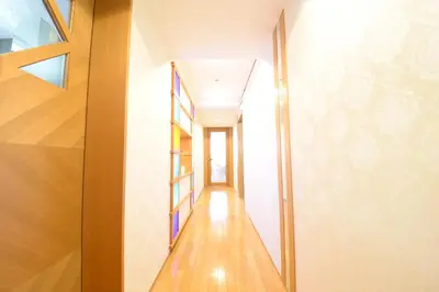 a hallway of a house with wooden floors and a window at NY Cottage\uff08\u30b3\u30c6\u30fc\u30b8\uff09 in Tokyo