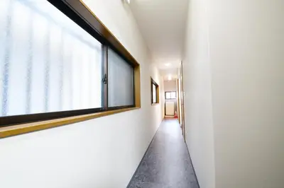 a hallway with a large window in a building at NY Cottage A in Tokyo