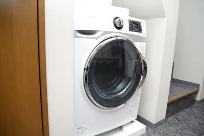 a white washer and dryer in a room at NY Cottage B in Tokyo