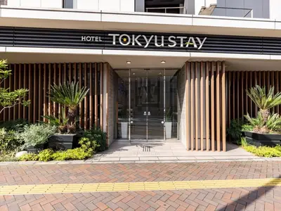 a hotel front entrance with a hotel tokyoysseystay at Tokyu Stay Shimbashi - Ginza area in Tokyo
