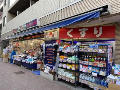 a store front of a store with drinks and other products at PAPA301 in Tokyo