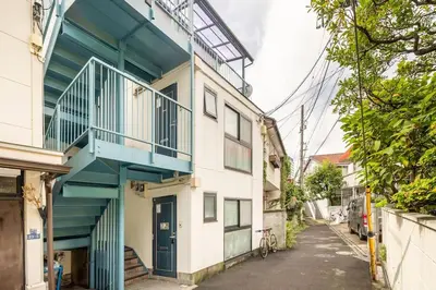 a building with a balcony on the side of it at PAPA301 in Tokyo