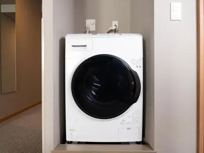 a white washer and dryer in a room at MIMARU SUITES Tokyo Asakusa in Tokyo