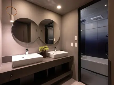 a bathroom with two sinks and a mirror at MIMARU SUITES Tokyo Asakusa in Tokyo