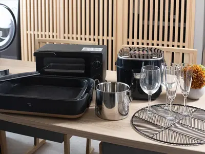 a table with a toaster and wine glasses on it at MIMARU SUITES Tokyo Asakusa in Tokyo