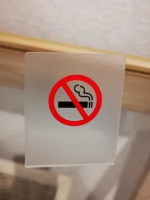 a sign with a no smoking sign on a drawer at Leisure hotel \u4e2d\u91ce in Tokyo
