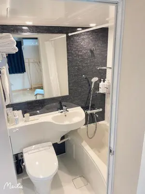 a bathroom with a sink and a toilet and a bath tub at Leisure hotel \u4e2d\u91ce in Tokyo