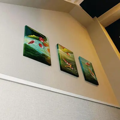 a group of paintings hanging on a wall at AYA Hotel in Tokyo