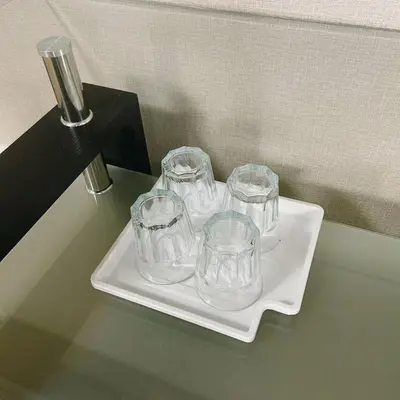 a tray with four empty glasses on a table at Shiki no Sai Asakusa in Tokyo