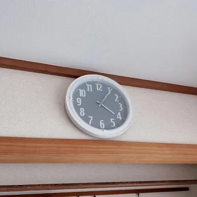 a clock on the ceiling of a room at Shiki no Sai Asakusa in Tokyo